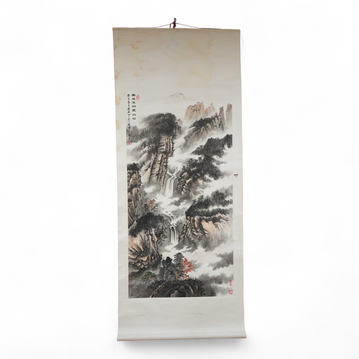 A Chinese scroll, hand painted with a mountainous landscape, 82cm wide